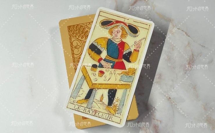 ニコラ・コンヴェル版タロット〝手品師（Le Bateleur）〟のカード。人物が卓上のアイテムとともに描かれ、伝統的なマルセイユ版の様式が反映されたデザイン。